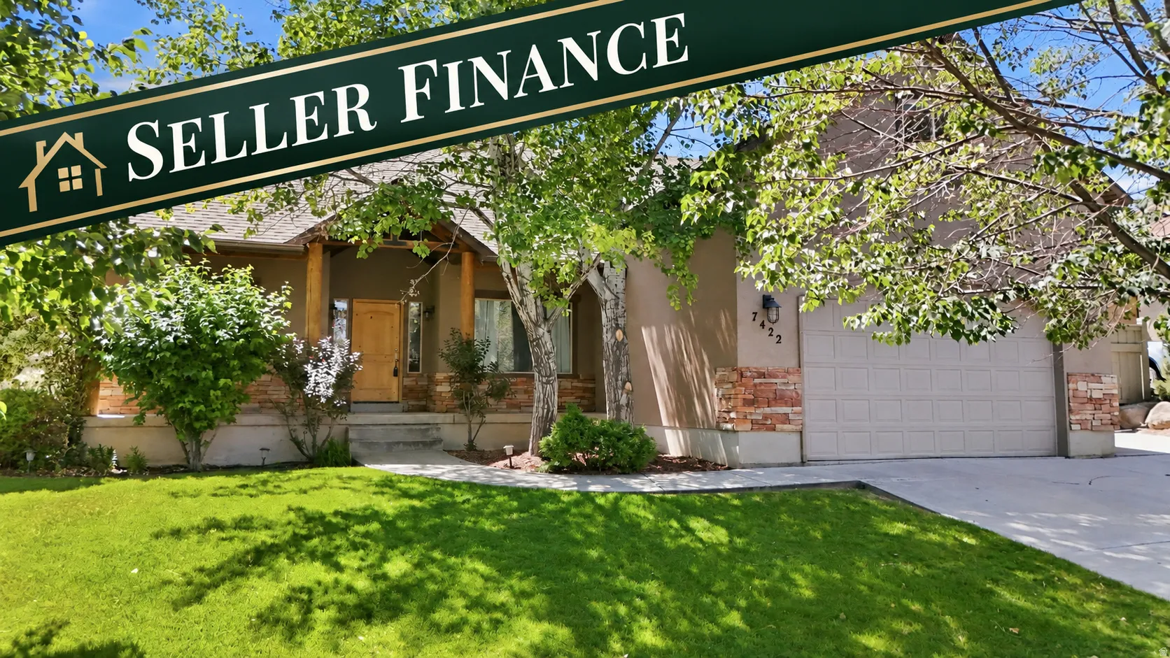 Front exterior with a manicured lawn, stone accents, and a covered entry with wood columns