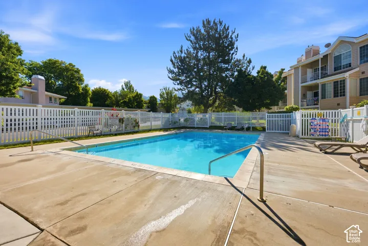 Rectangular swimming pool with integrated entry steps and stainless steel handrails