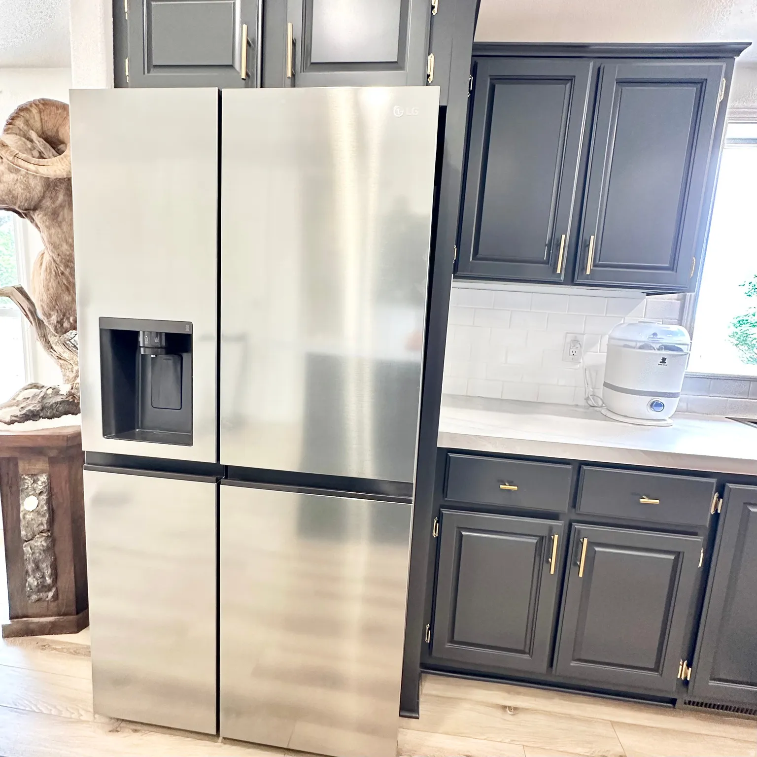 Stainless steel French door refrigerator with an external ice and water dispenser