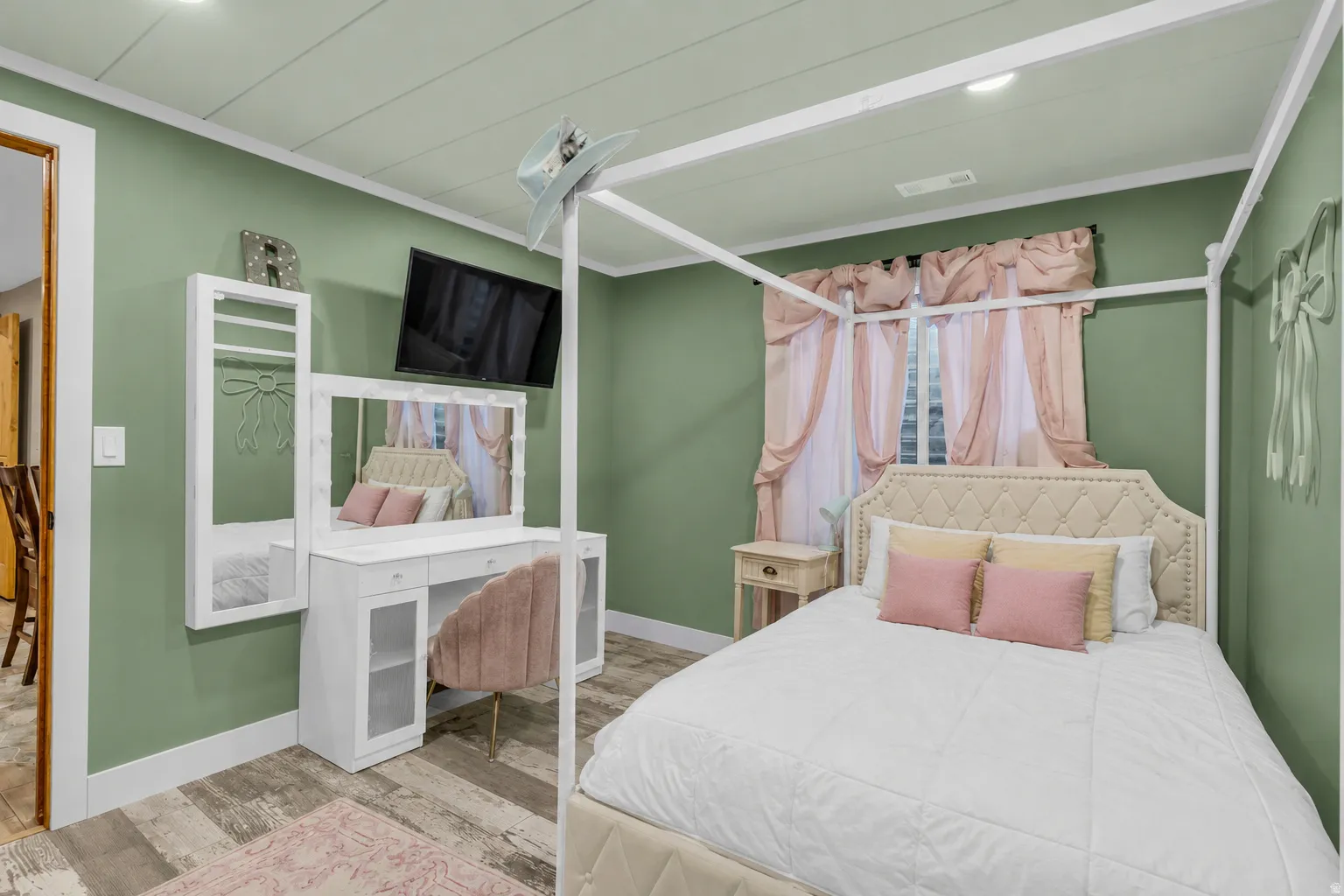 Room featuring wood-finish flooring, recessed lighting, and a window with natural light