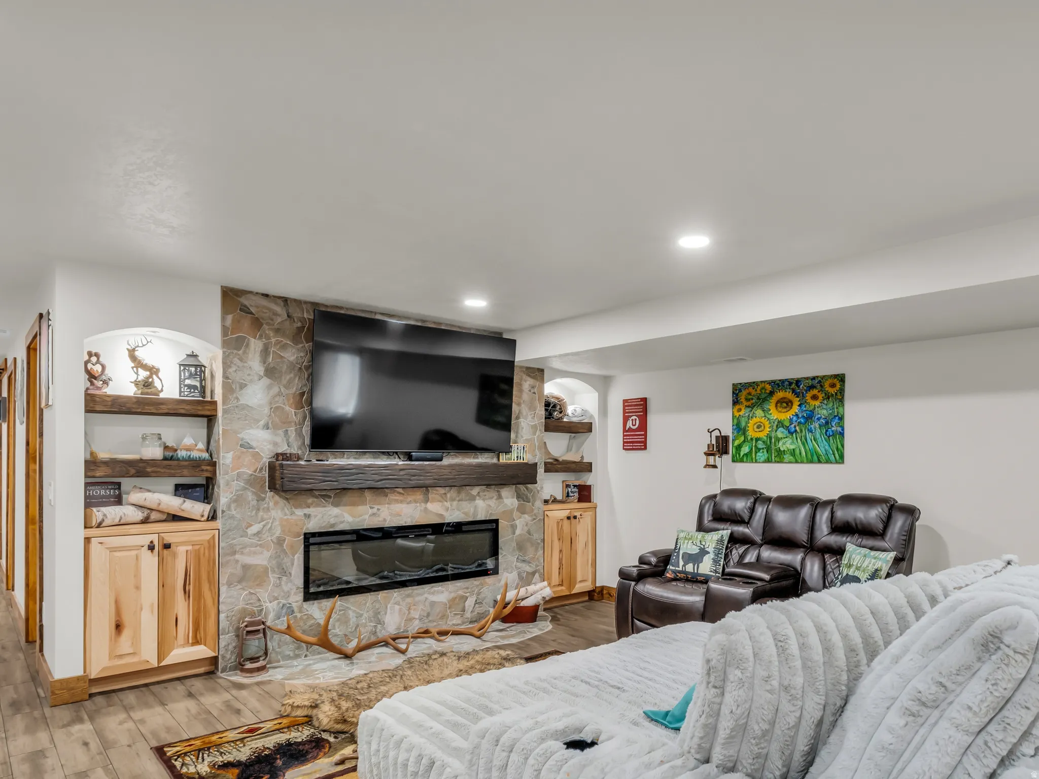 Feature wall with stacked stone surround and integrated linear fireplace