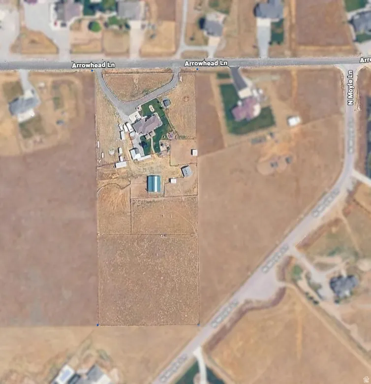 Aerial Map. Depicting the property outline and surrounding areas. Blue dots are marking the corners of the property.