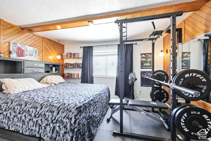 Room featuring a built-in bed frame with integrated storage and shelving