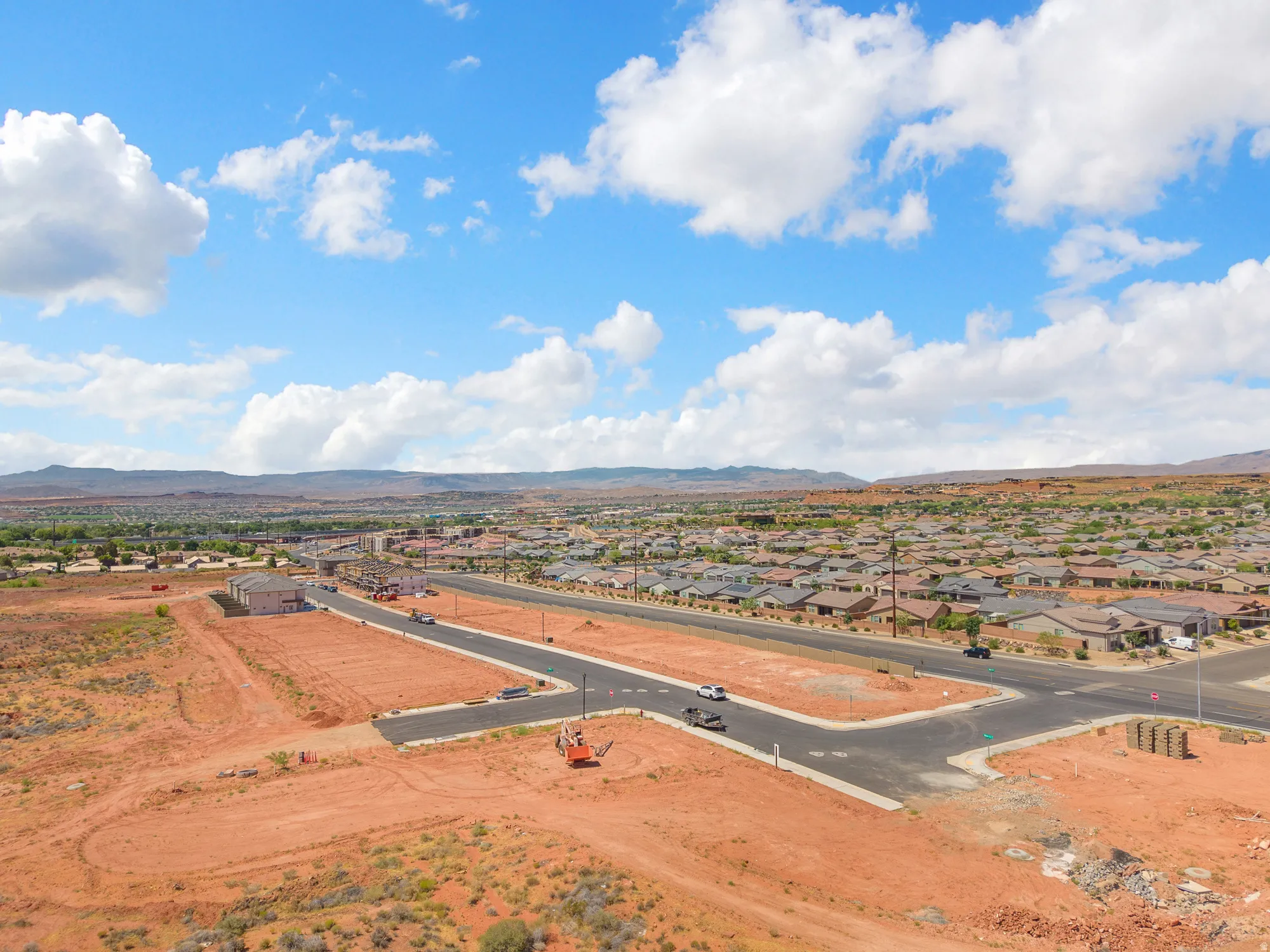Developing community featuring paved roads, established homes, and desert landscaping