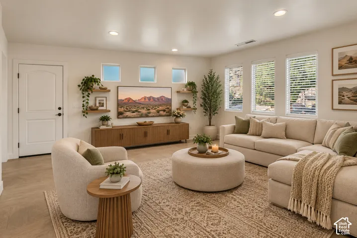 Recessed lighting, wood-finish flooring, multiple windows with blinds, built-in shelving, and a built-in media console