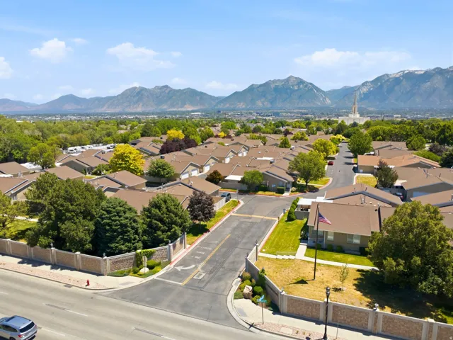 Residential community featuring a uniform roofline and mature landscaping