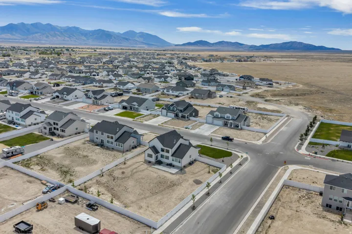 Aerial view showcasing a residential development with numerous newly constructed homes