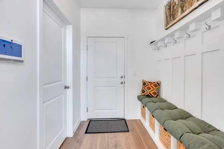 Entryway featuring wood-finish flooring and white walls