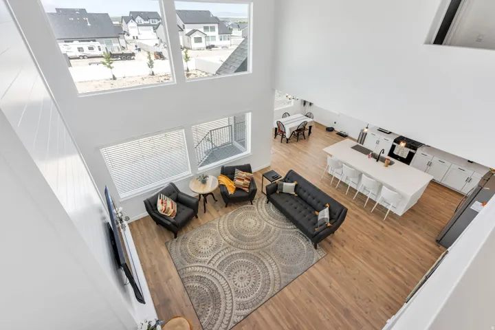 Open-concept living area with soaring ceilings and abundant natural light