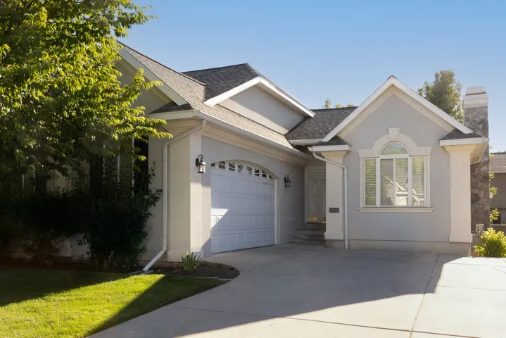 Stucco exterior with an attached two-car garage