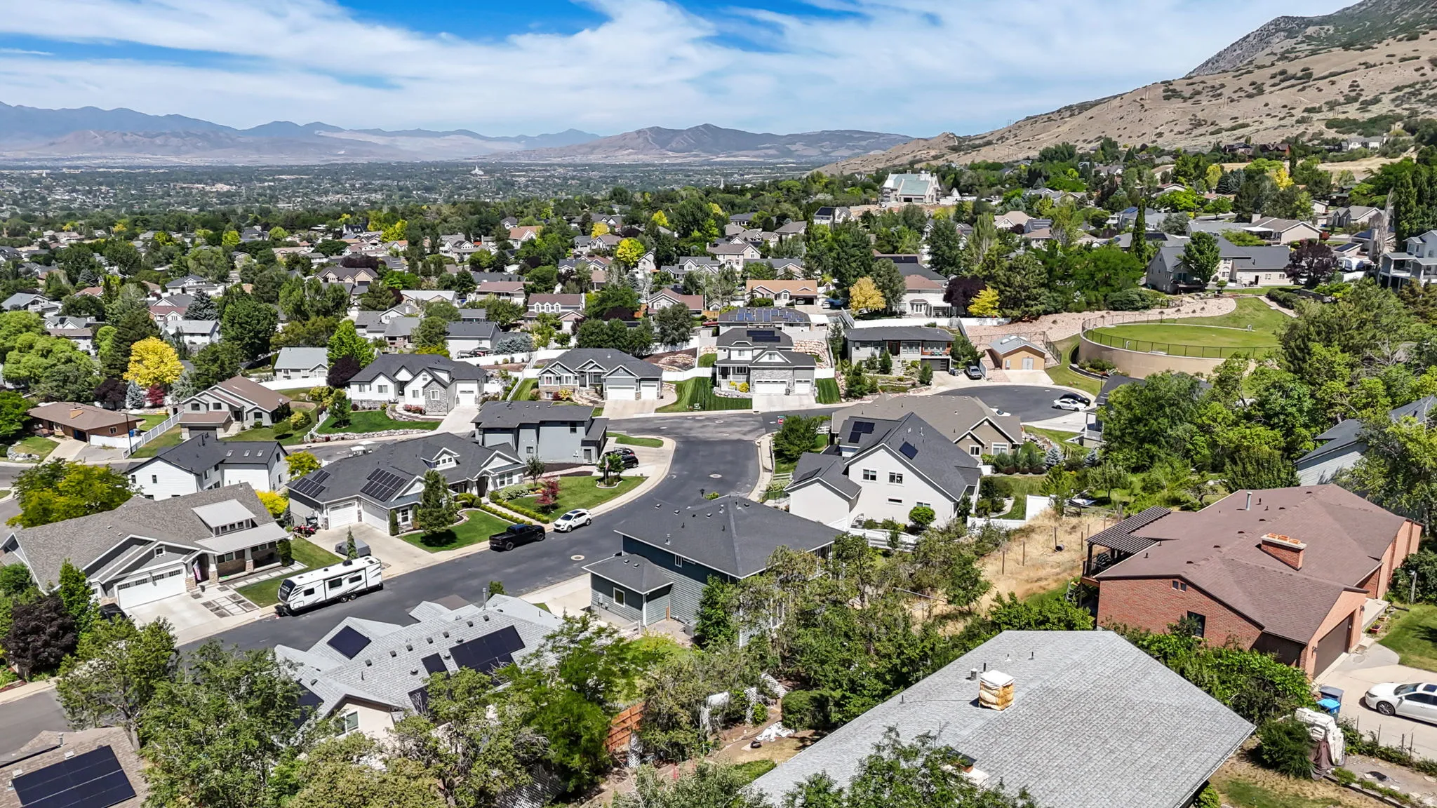 Expansive residential area with a prominent backdrop of distant mountains