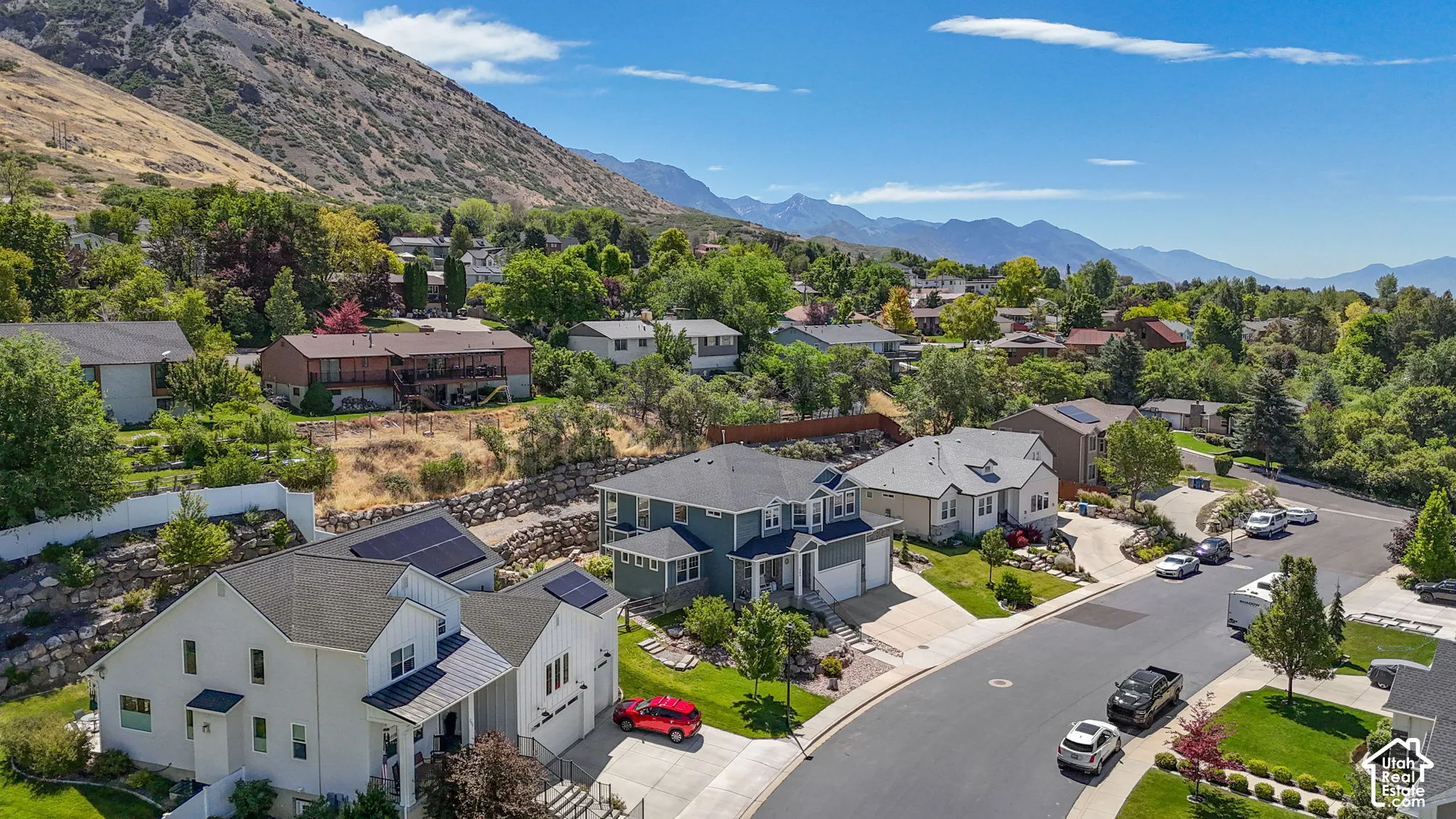 Residential street with a mountain backdrop