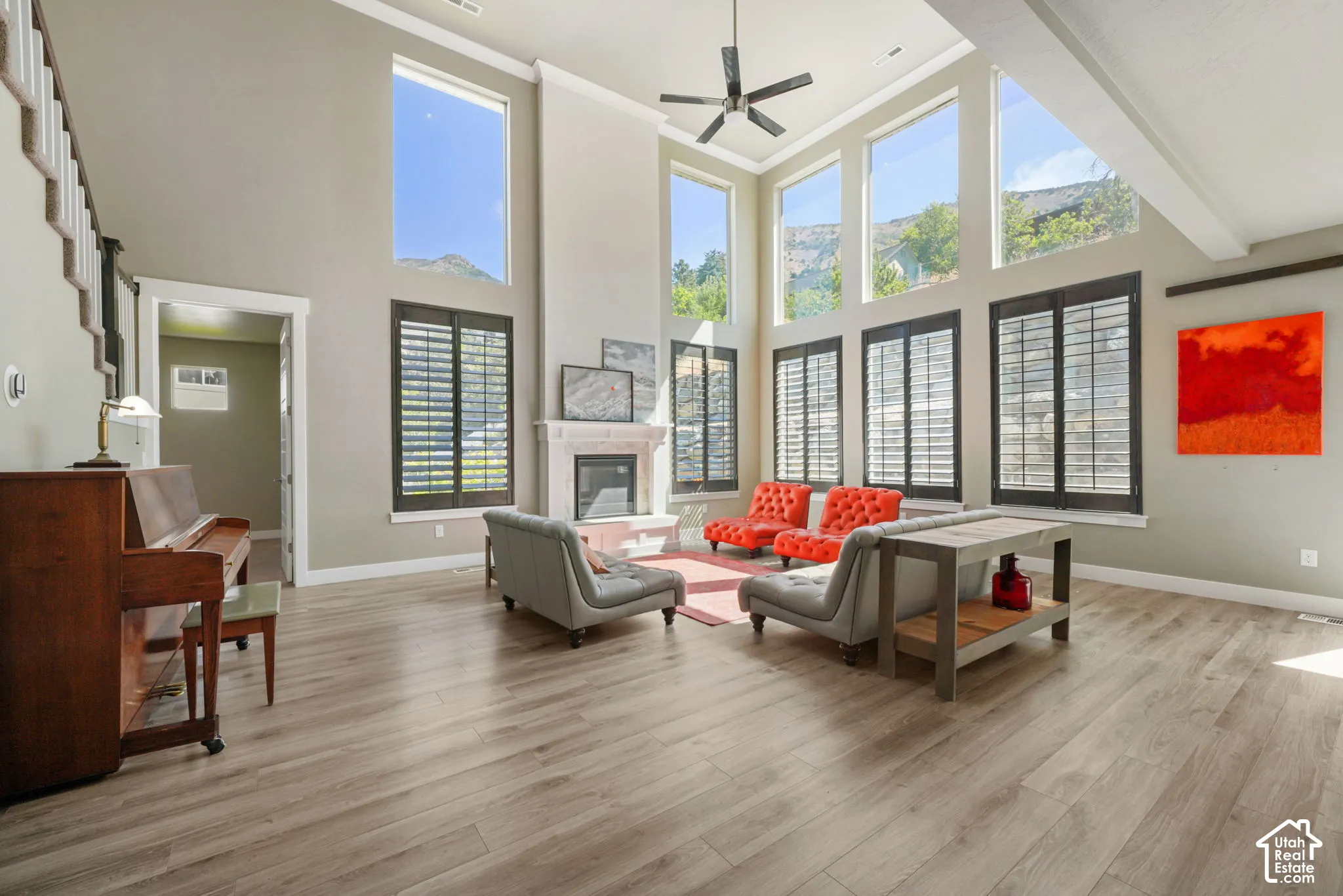 Spacious interior with high ceilings and wood-finish flooring