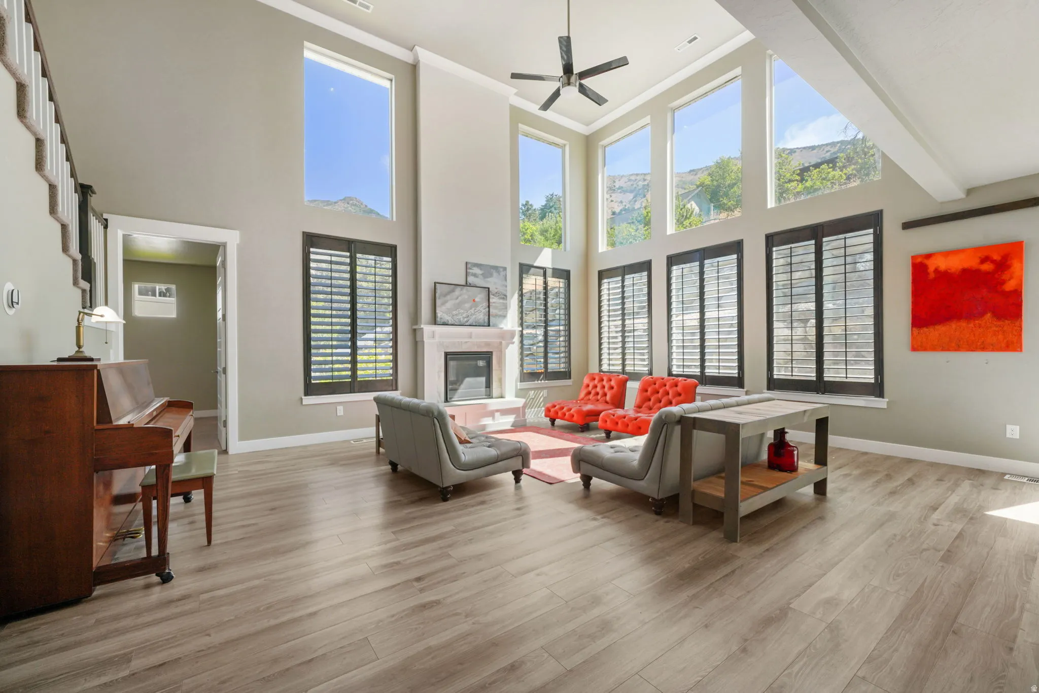 Spacious interior with high ceilings and wood-finish flooring