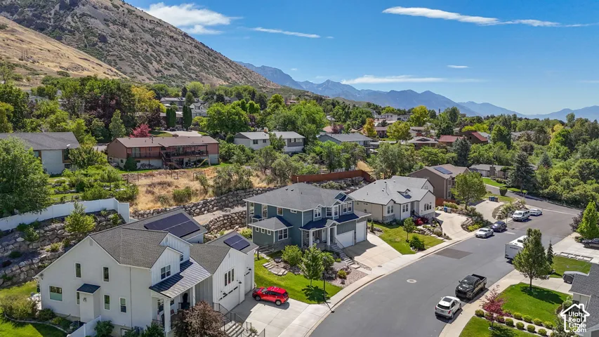Residential street with a mountain backdrop
