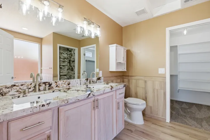 Dual vanity with undermount sinks and extensive countertop space