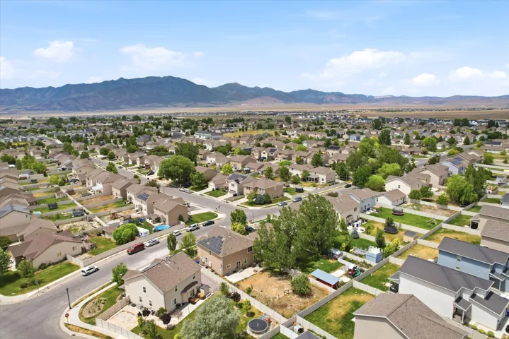 Expansive residential neighborhood featuring single-family homes with pitched roofs and fenced backyards