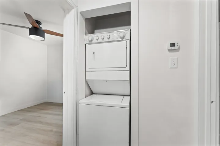 Dedicated laundry area with stacked appliances