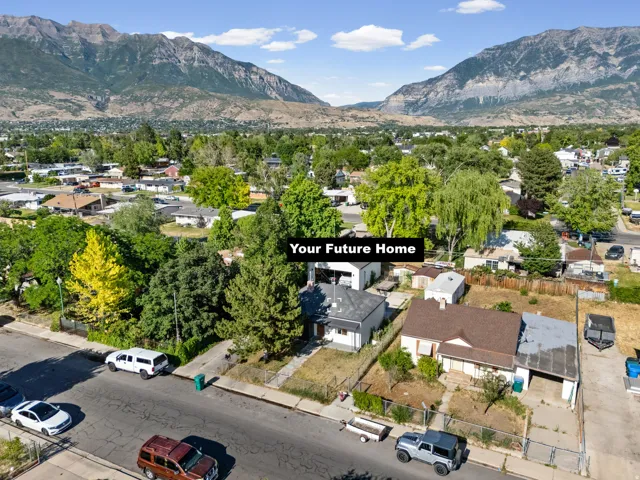 Aerial view showcasing a residential property with a partial privacy fence