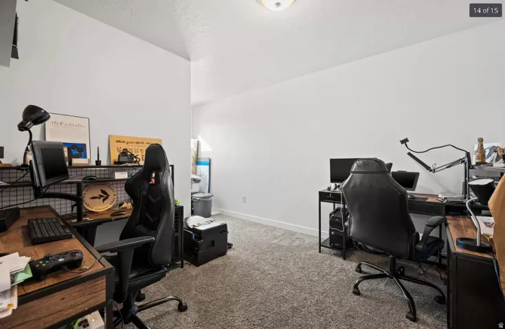 Carpeted room with white walls, featuring a semi-flush ceiling light fixture