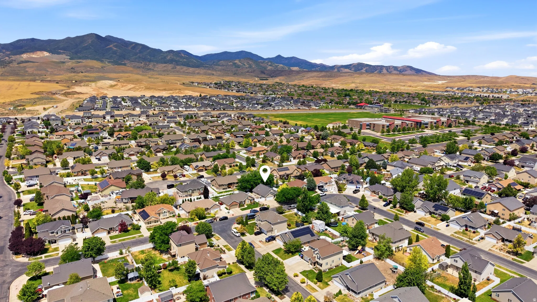 Expansive residential neighborhood with distant mountain ranges