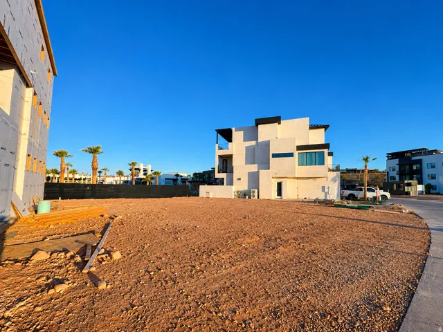 Spacious undeveloped lot featuring a paved curb and street frontage