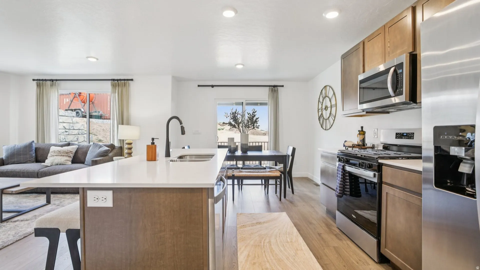 Kitchen island featuring a white countertop and integrated sink