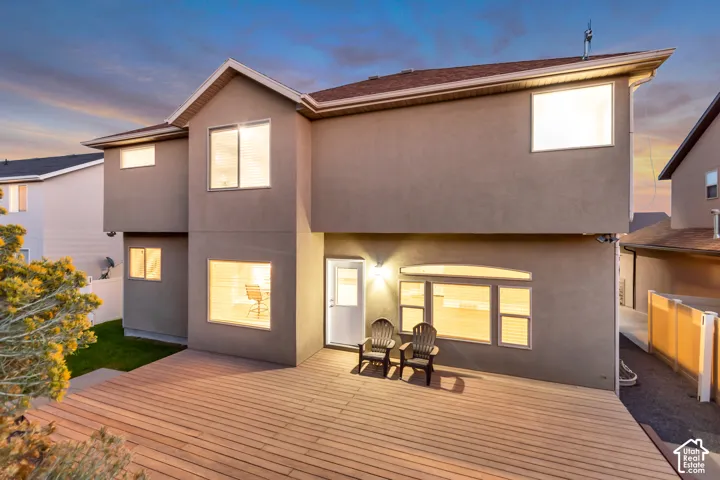 Multi-level exterior with a large wood-finish deck