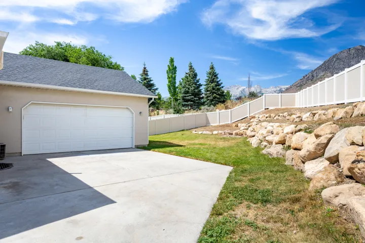 Attached two-car garage with a concrete driveway