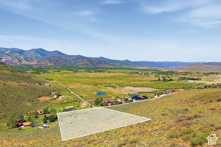 Expansive undeveloped lot with a mountainous backdrop