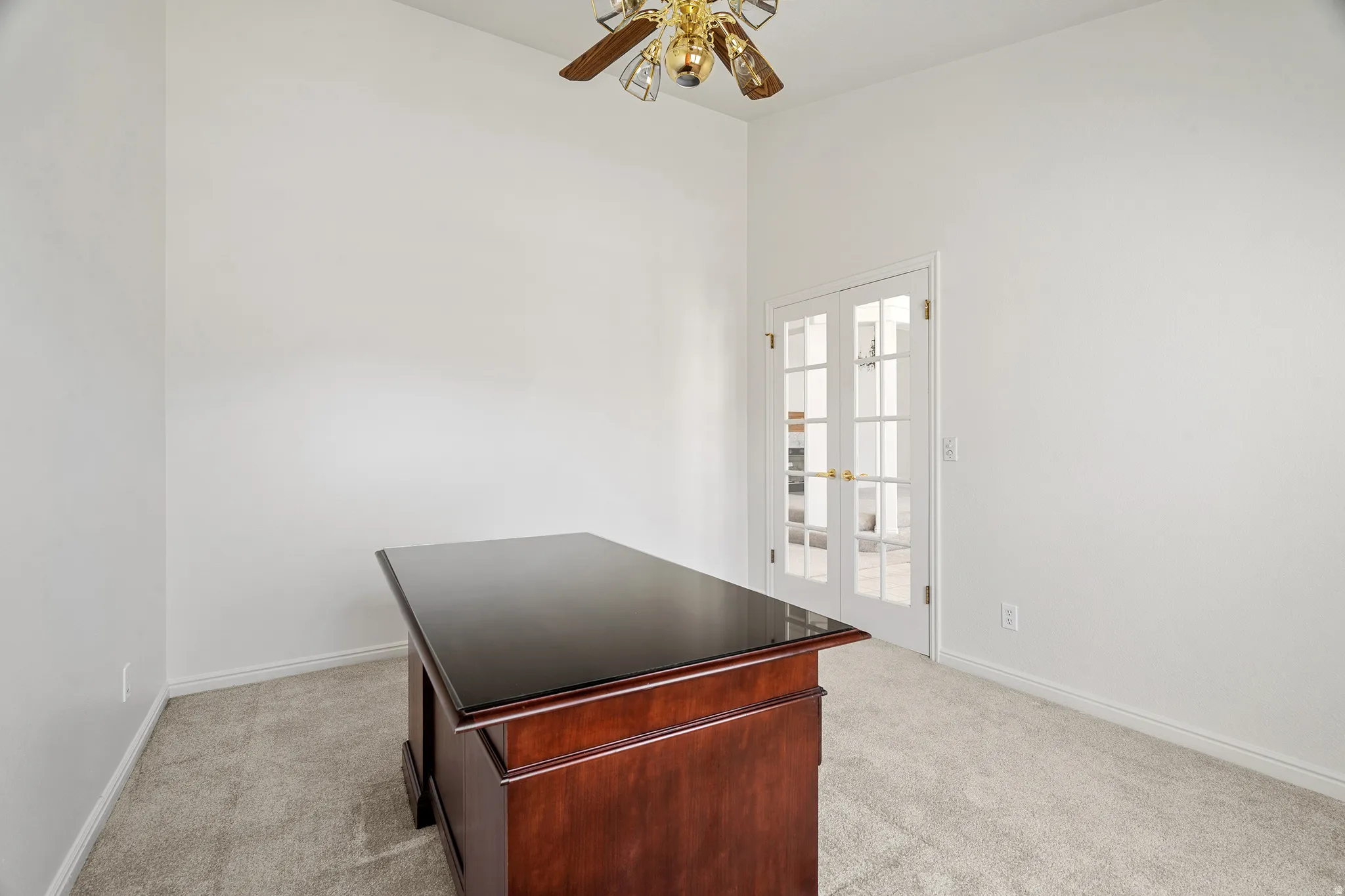 Bright room with neutral wall paint and plush carpeting
