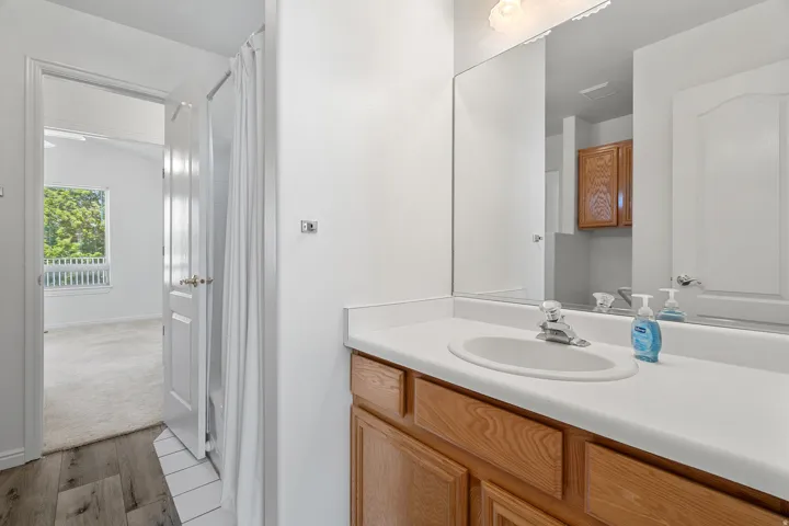 Bathroom vanity with a white countertop and an integrated sink
