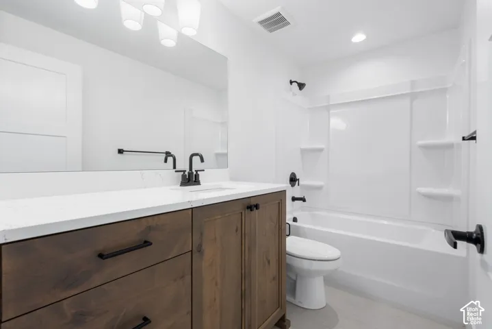 Wood-finish vanity with a white stone-finish countertop, matte black faucet, and rectangular undermount sink