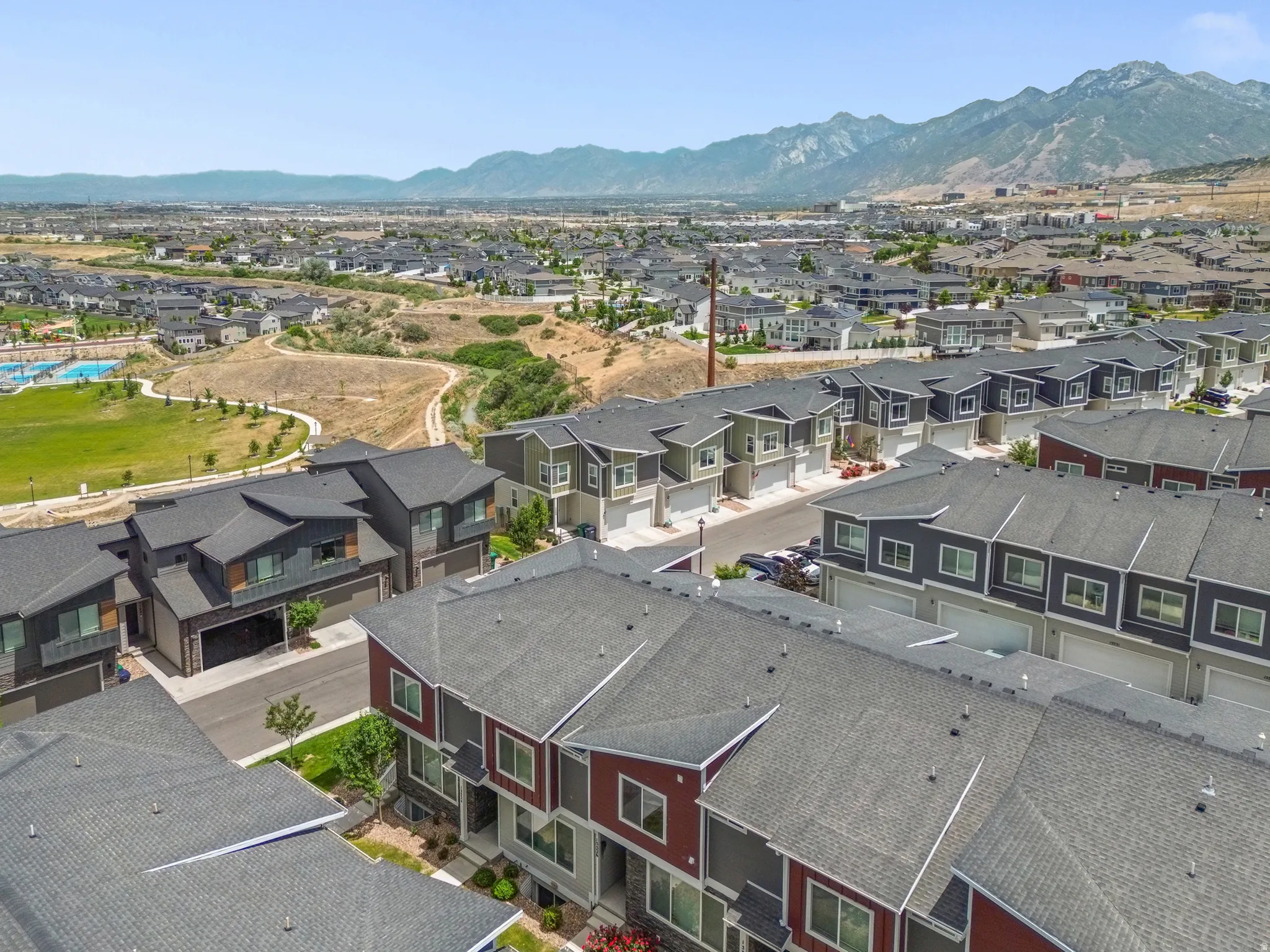 Contemporary townhome community featuring diverse architectural styles and color palettes