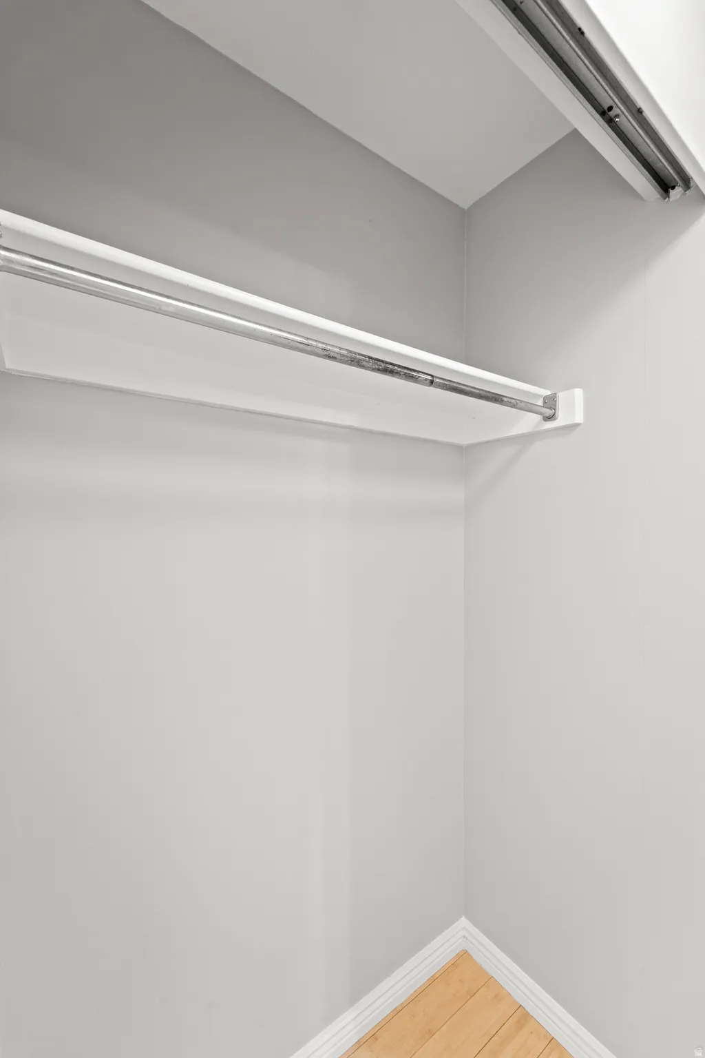 Primary bedroom walk in closet left side