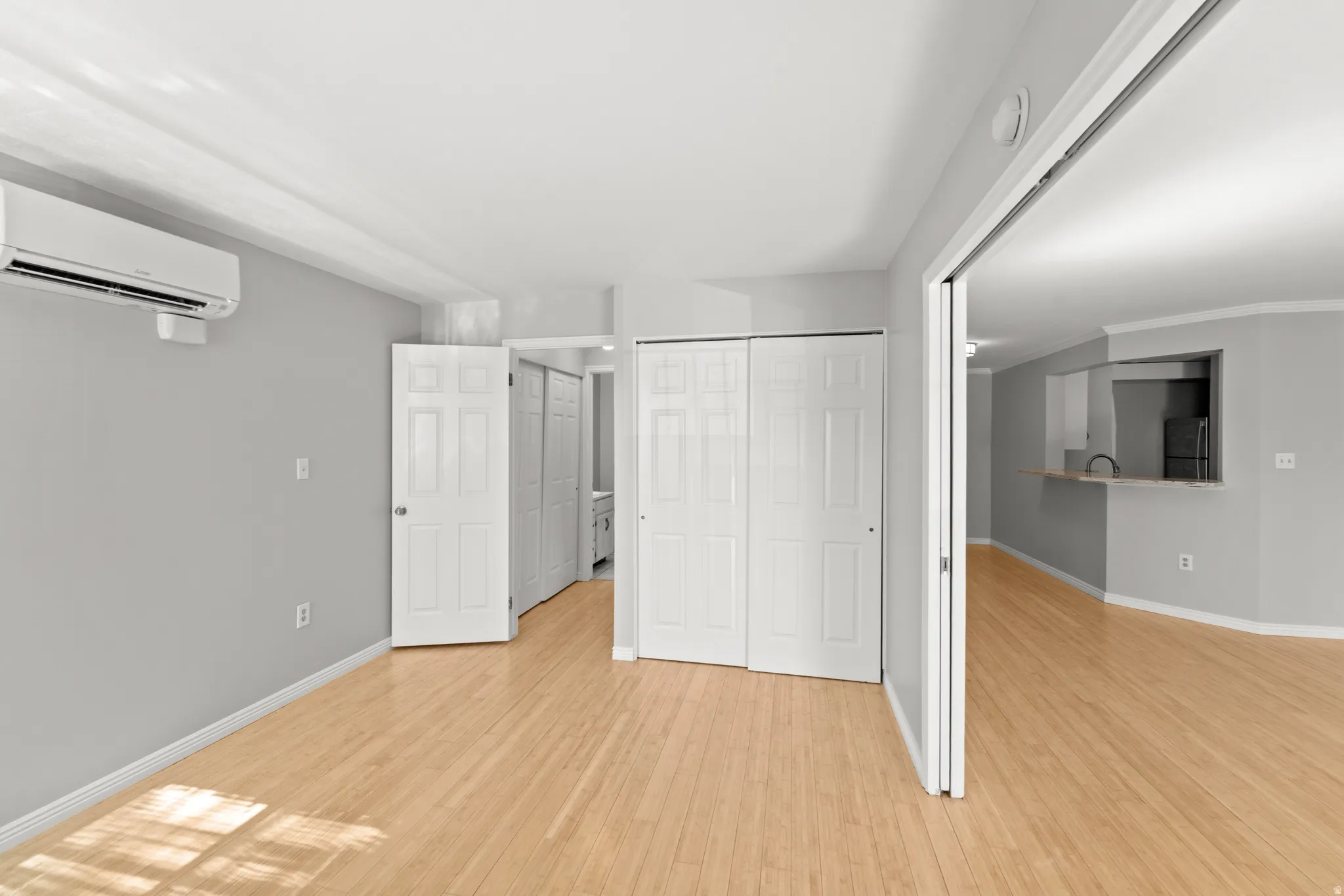 The second bedroom has large French doors (shown open) make it easily usable as a bedroom, office, or additional living space.