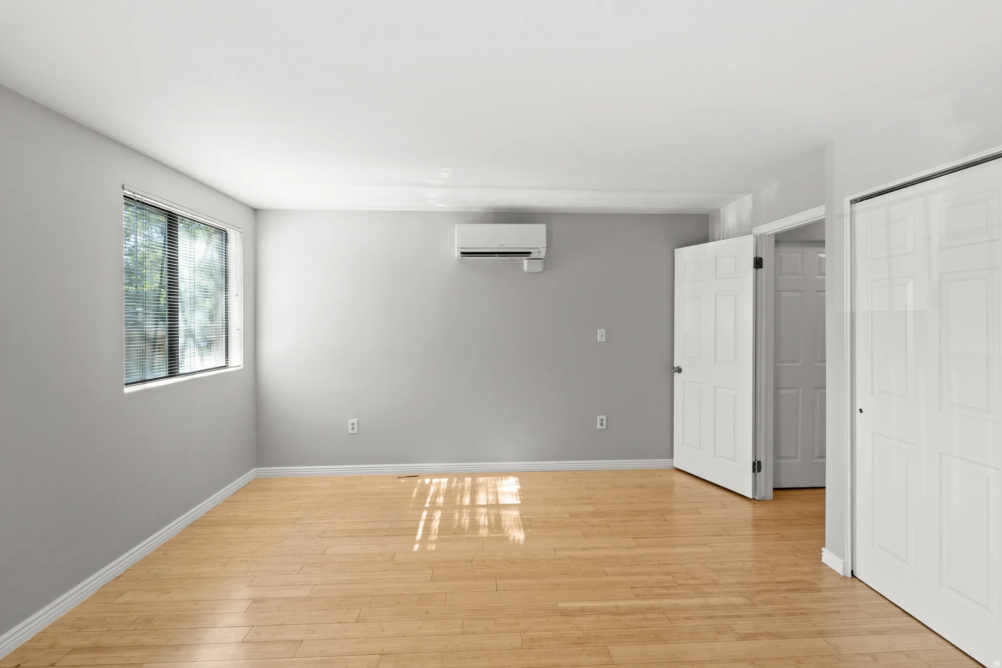 Secondary bedroom offers flexibility for guests, a home office, or roommate living.