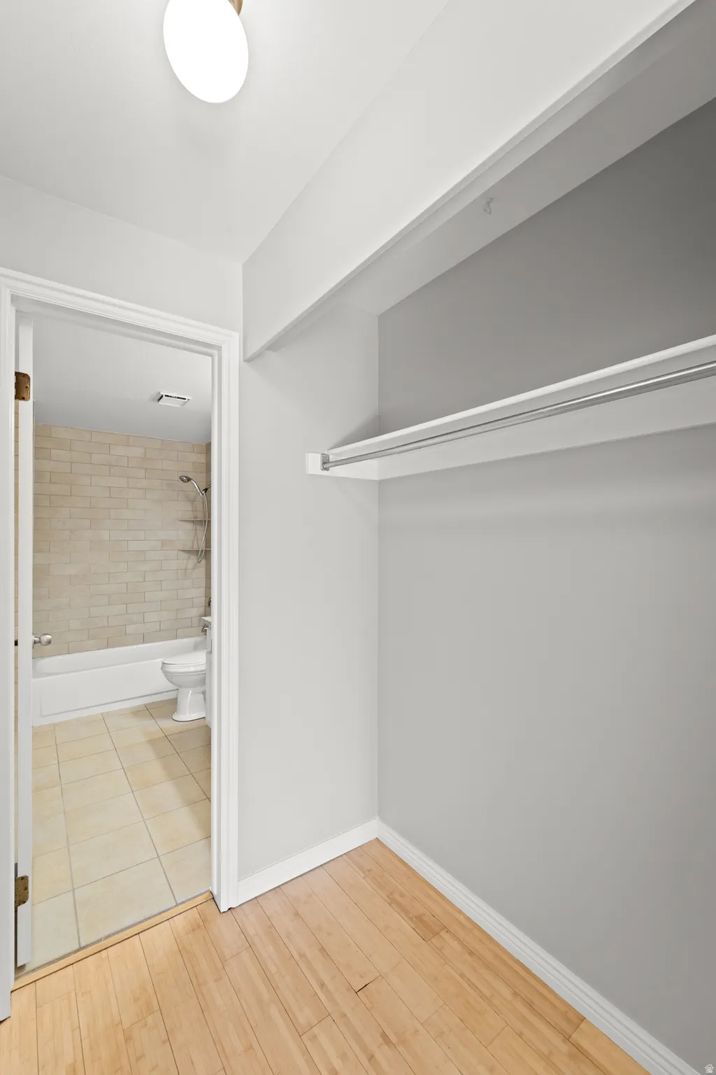 Primary bedroom walk in closet right side