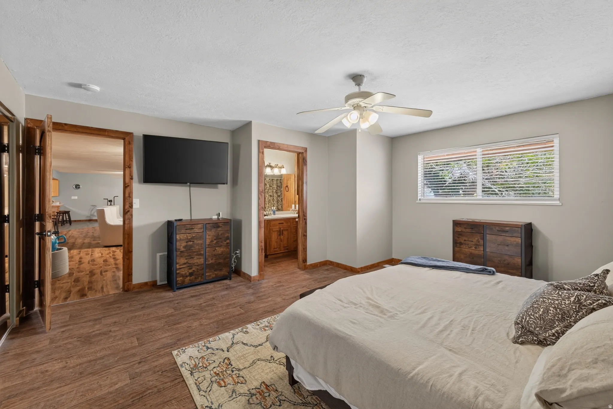 Bedroom featuring wood-finish flooring and a ceiling fan