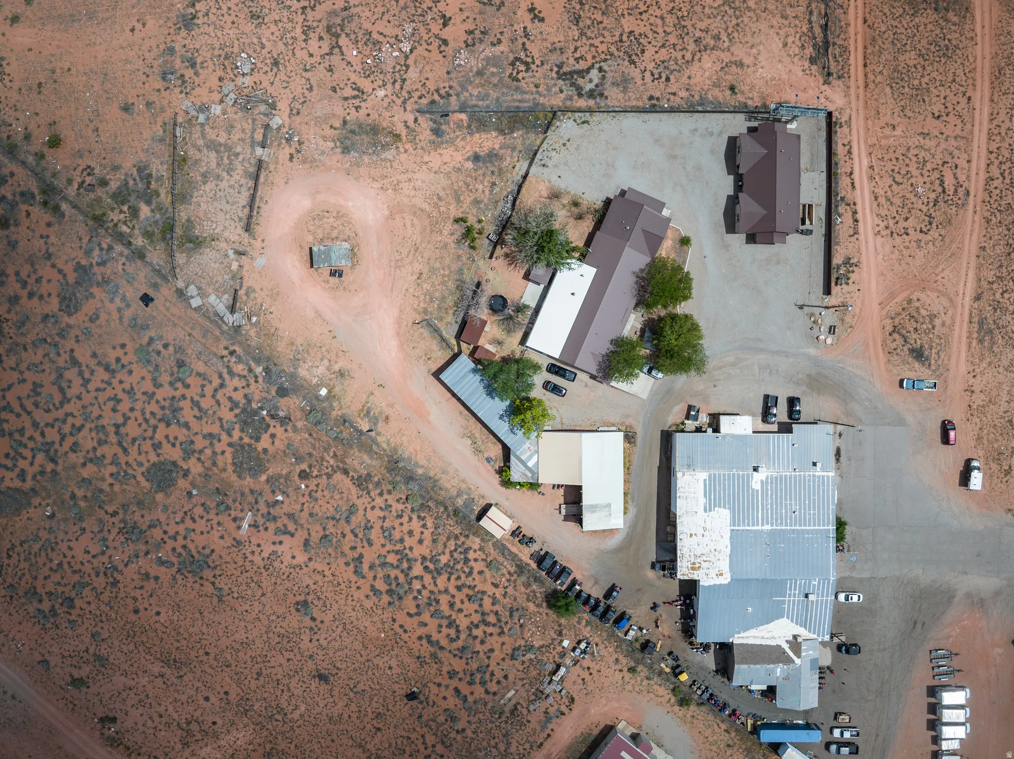 Expansive aerial view showcasing multiple structures on a large parcel of land