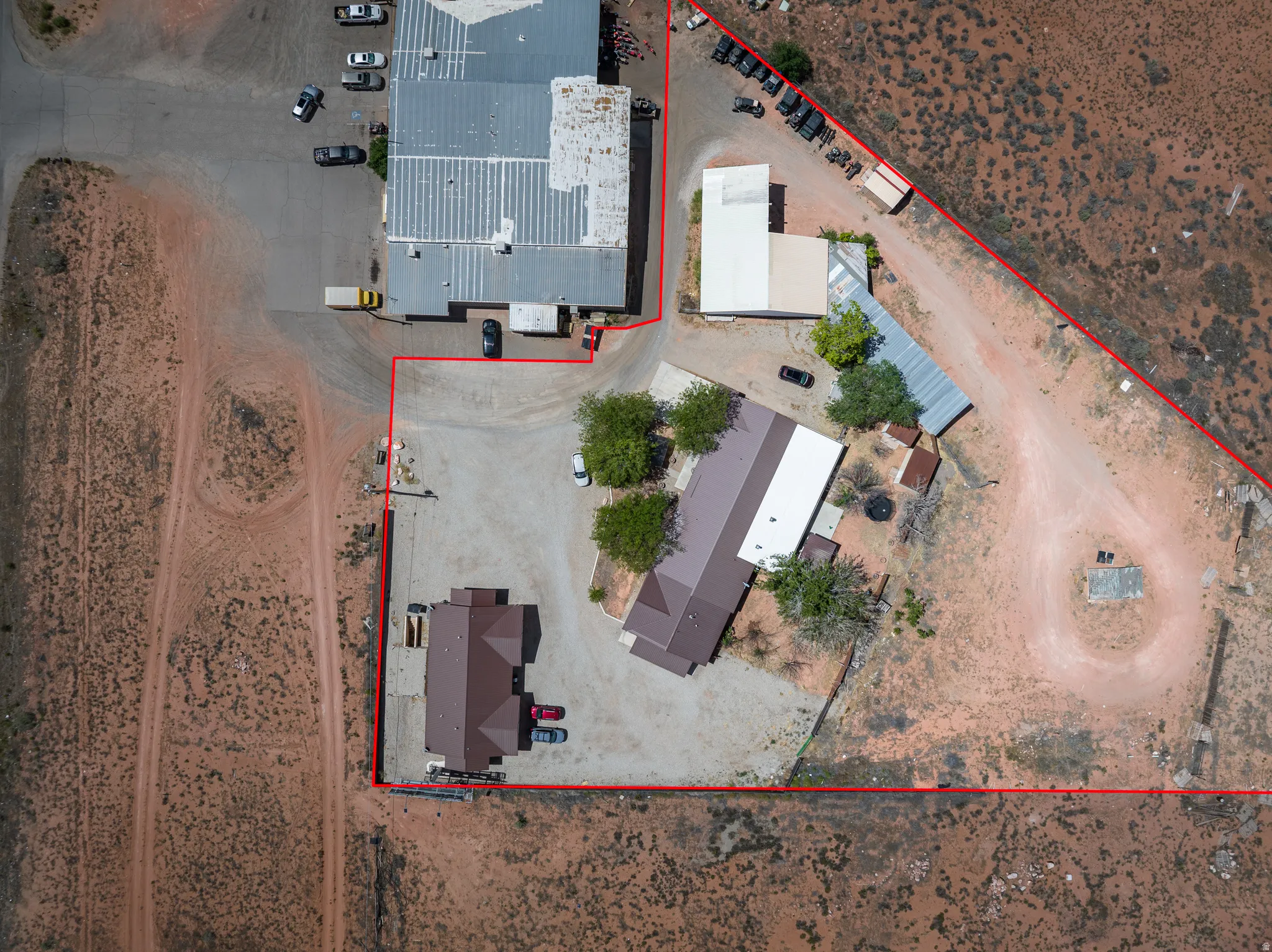 Aerial overview showcasing multiple structures on a large parcel