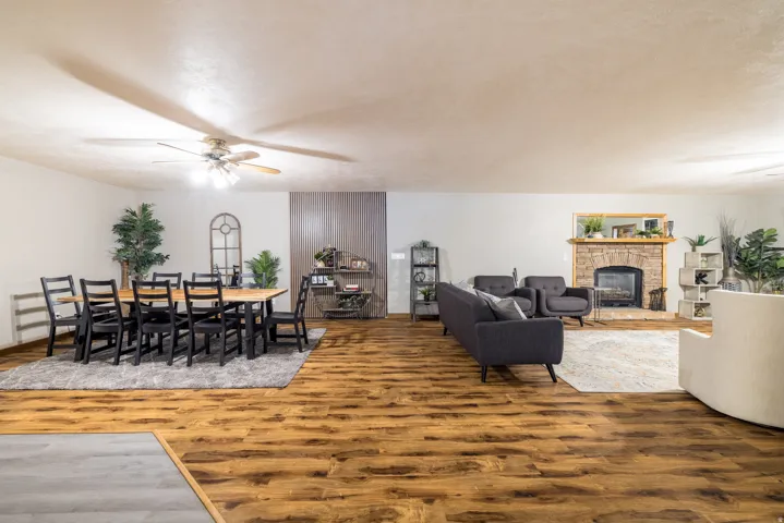 Spacious room featuring wood-finish flooring throughout