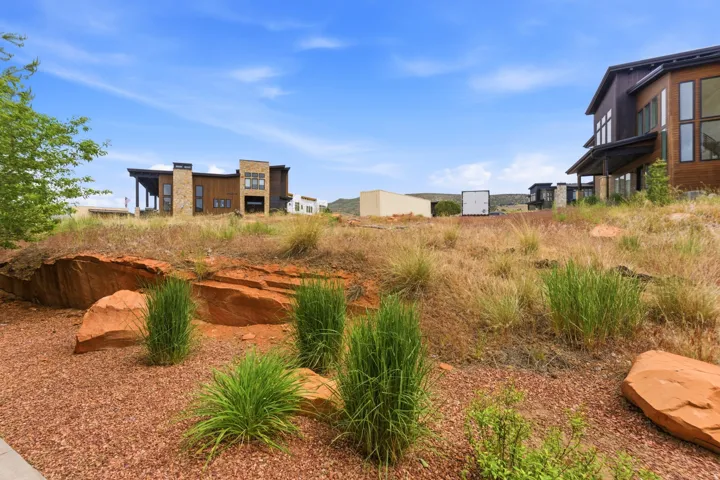 Modern residence with wood siding and stone accents