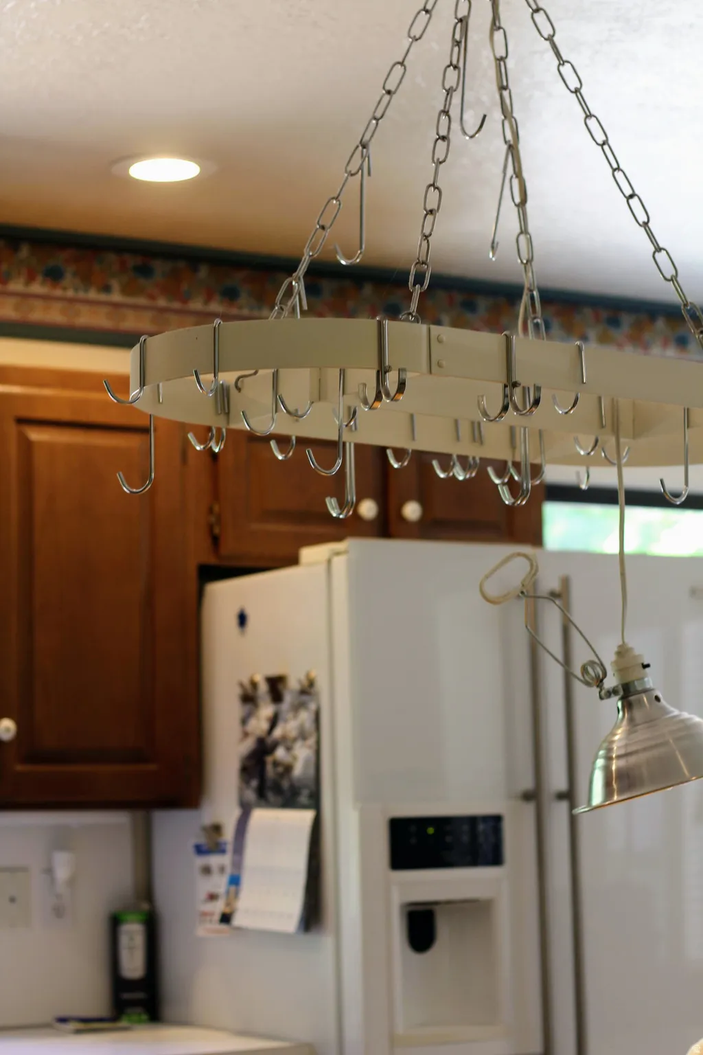 Ceiling-mounted pot rack with integrated hooks