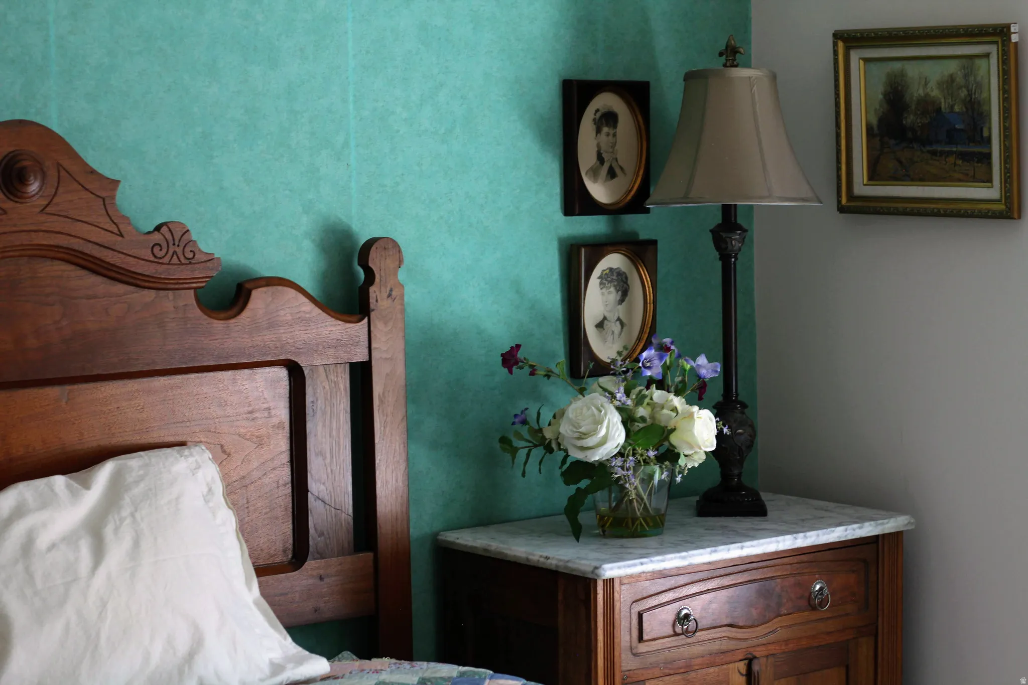 Carved wood headboard with a scalloped top and decorative detailing