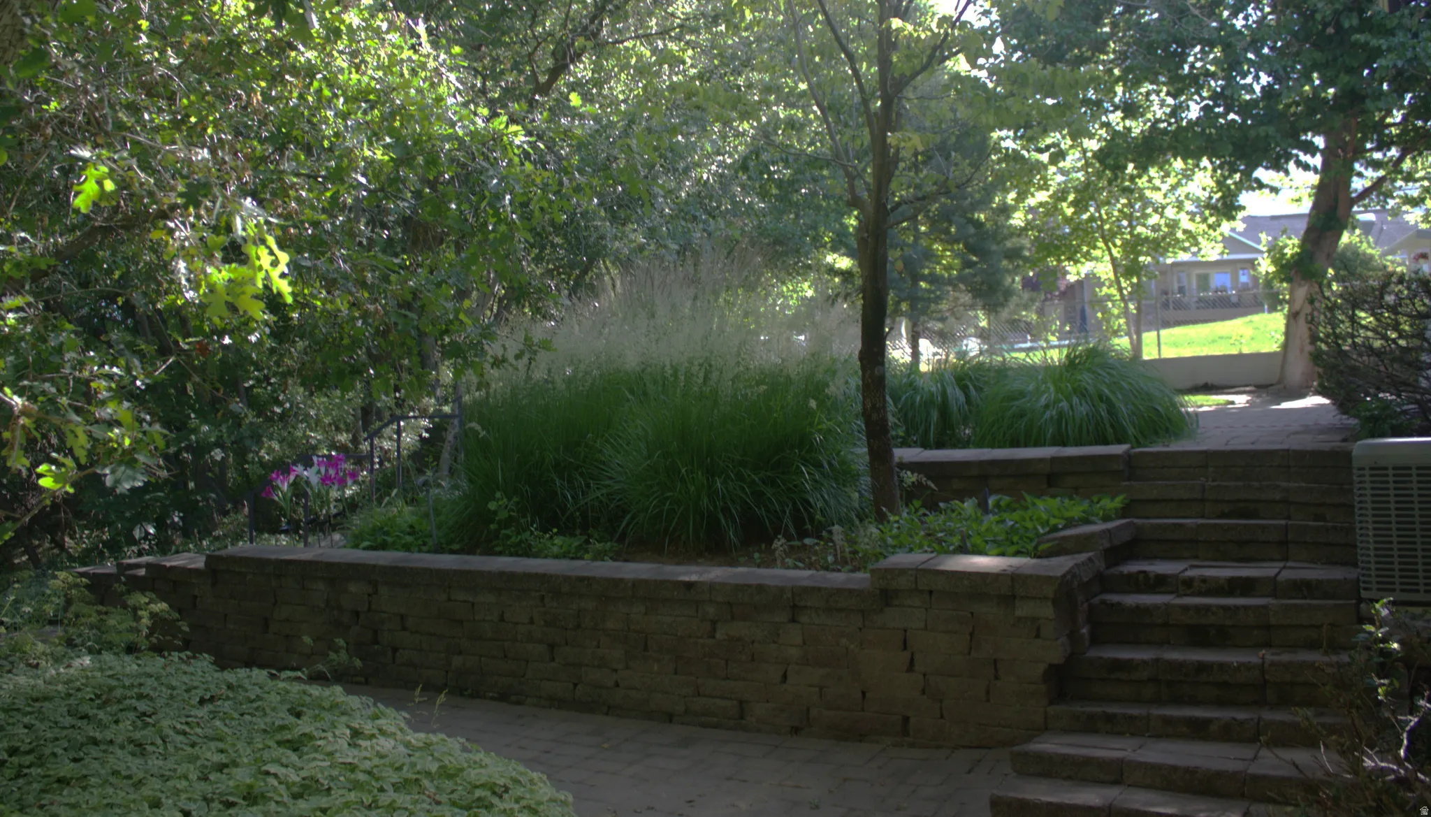 Terraced landscaping featuring stone retaining walls and steps