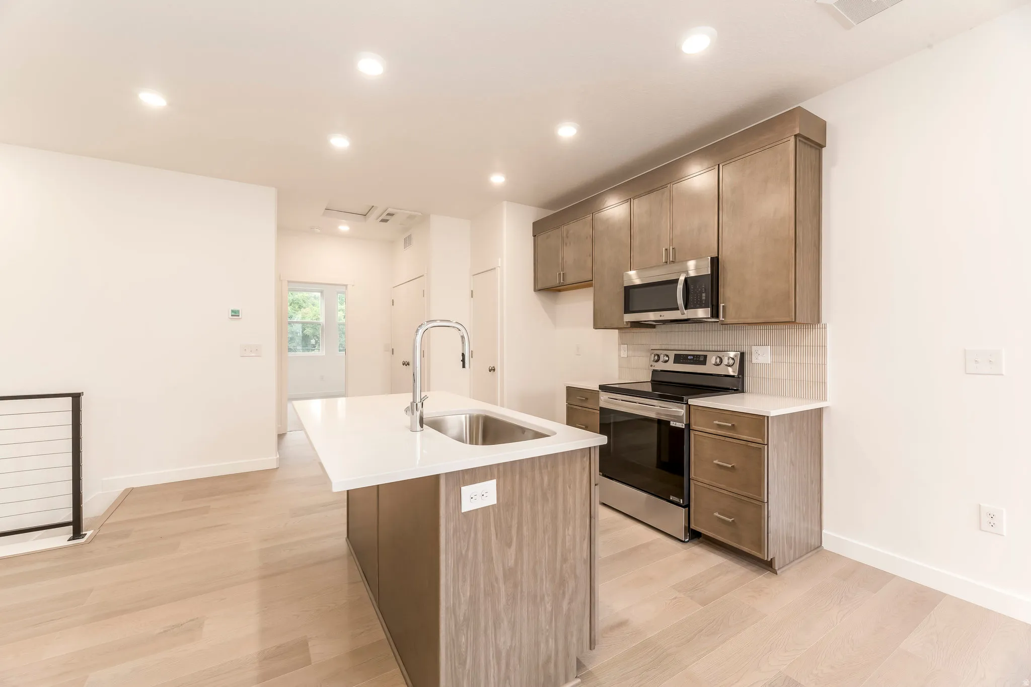 Whether it’s a quick breakfast or dinner with friends, this kitchen makes it easy. *model home