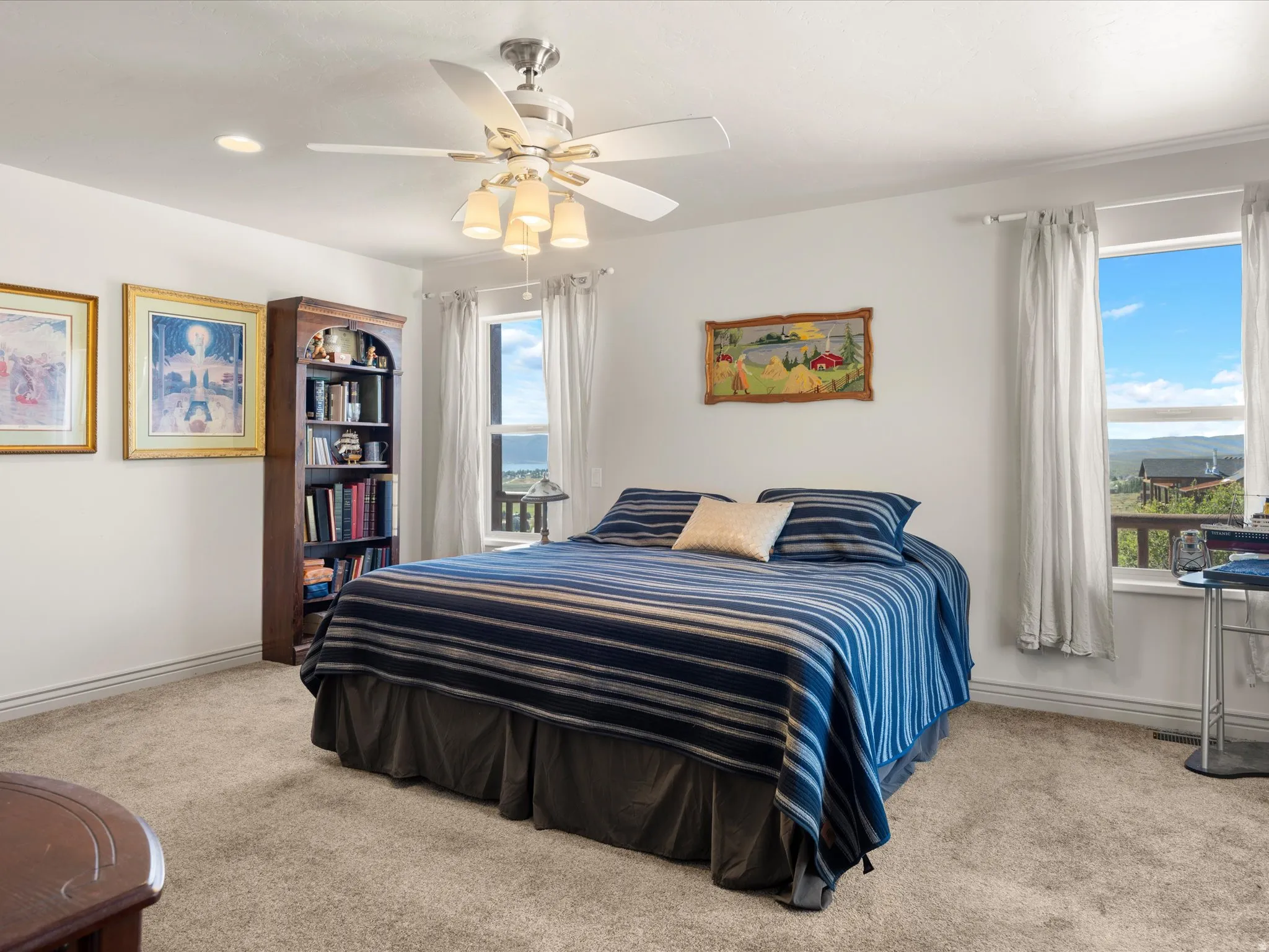 Spacious room featuring neutral carpet flooring and white walls