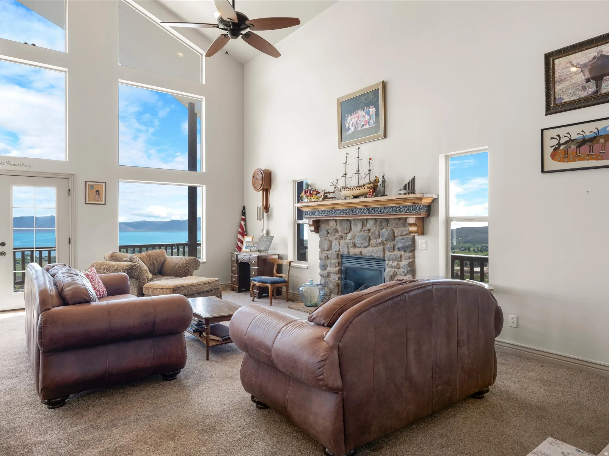 Living room featuring picture windows and water view