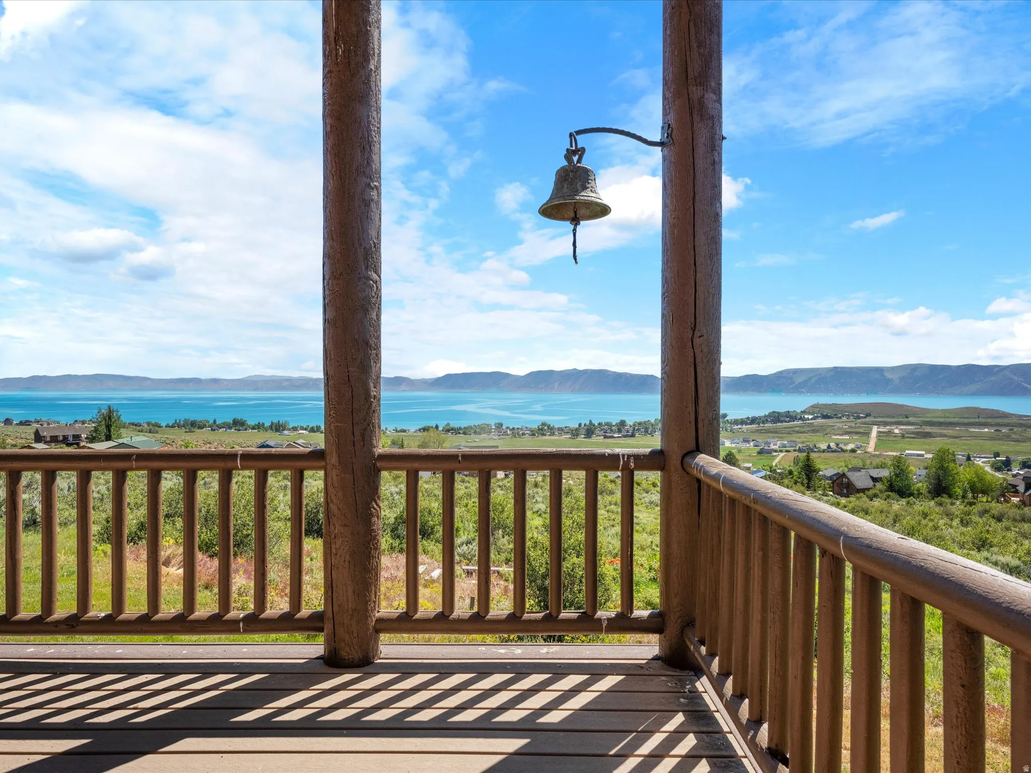 Expansive outdoor deck featuring wood-finish decking and railing